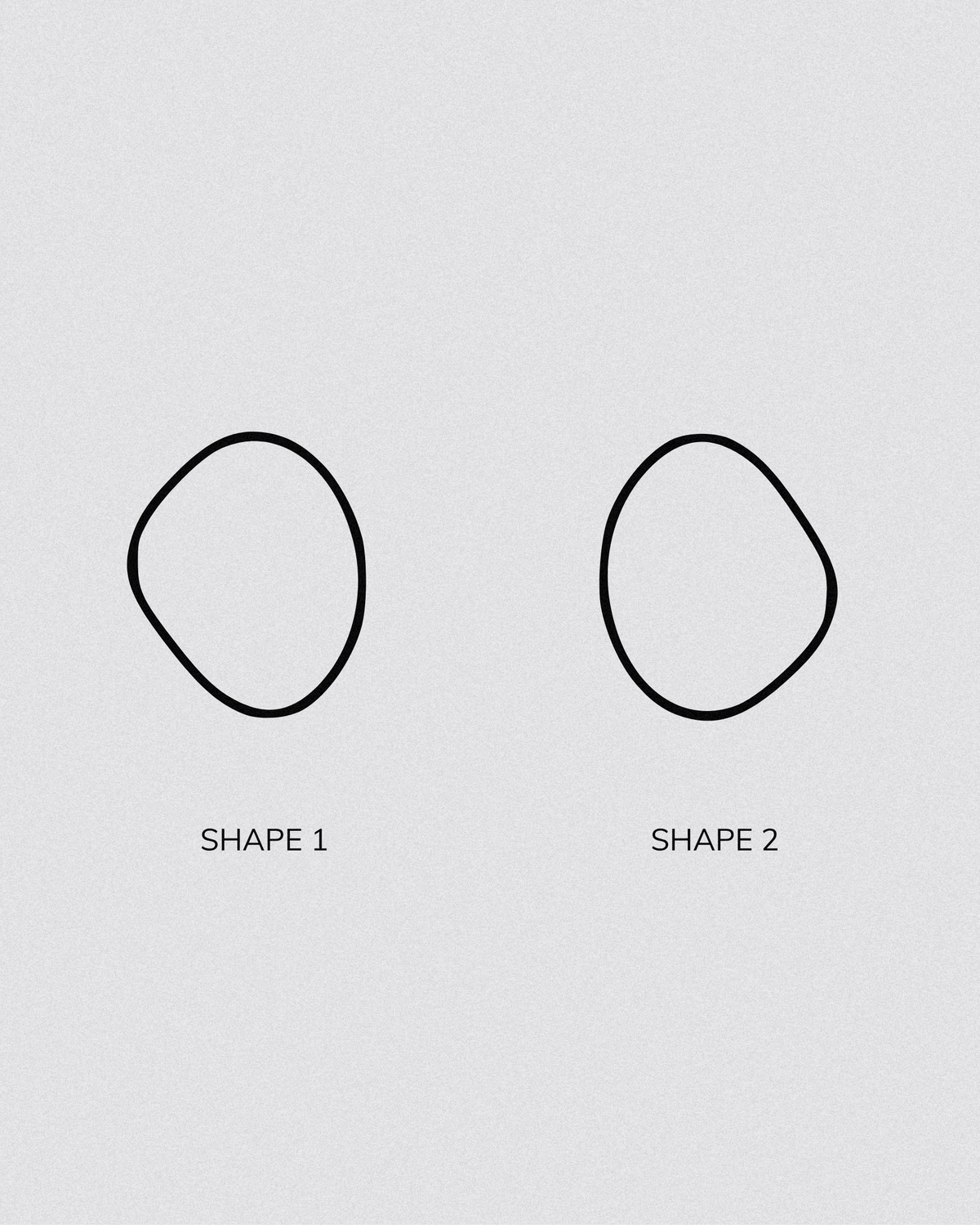 Two black oval shapes labeled 'Shape 1' and 'Shape 2' on a light gray background